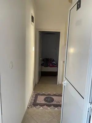 a hallway with a door leading to a bedroom at Apartmani Arieta in Donji Štoj