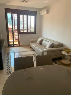 a living room with a couch and a table at Anatolia in Becici