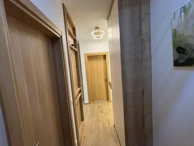 a hallway with a door leading into a room at Una Dobra Voda in Dobra Voda