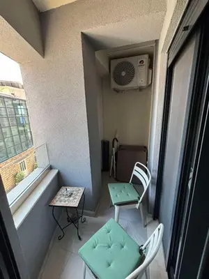 a small room with a table and chairs and a window at Una Dobra Voda in Dobra Voda
