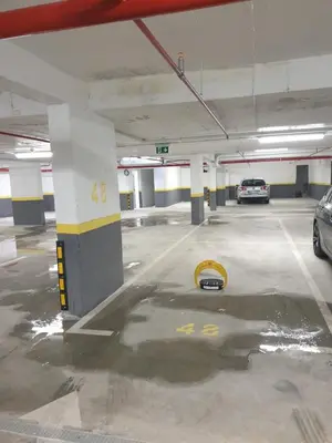 a parking lot with a car parked in a parking garage at Una Dobra Voda in Dobra Voda