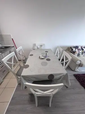 a kitchen with a table and chairs in a room at Ulcinja Apartment Pinjes in Ulcinj