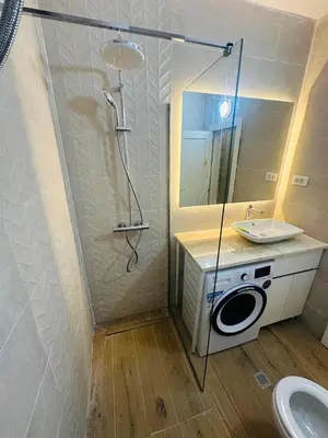 a bathroom with a shower and a sink and a toilet at Itana by the sea in Budva