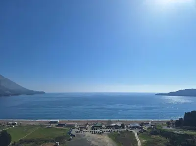 a large body of water with a group of houses at Skyline sea view apartment in Becici