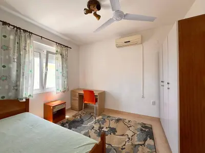 a bedroom with a bed and a ceiling fan at SeaMontAdriatic in Bar