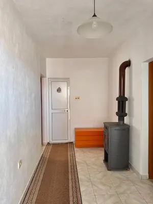 a room with a stove in a room with a door at SeaMontAdriatic in Bar