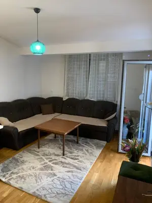 a living room with a couch and a table at Disa&Nuzi in Ulcinj