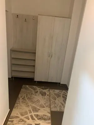 a room with white cabinets and a rug at Disa&Nuzi in Ulcinj