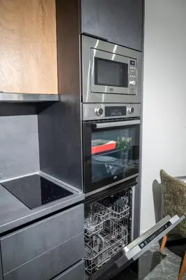 a kitchen with an oven with a microwave at Urban Nest Apartment in Ulcinj
