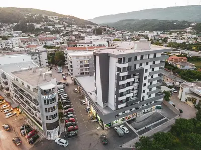 an aerial view of a building in a city at Urban Nest Apartment in Ulcinj