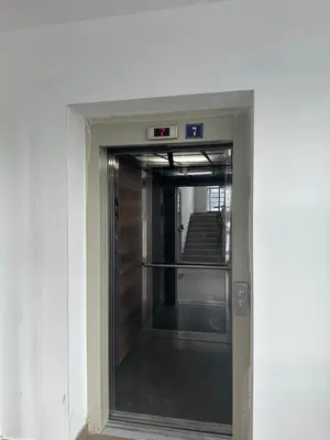 an elevator door in a building with a staircase at Dubovica Hill in Budva