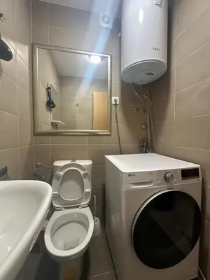 a bathroom with a toilet and a sink and a mirror at Dubovica Hill in Budva
