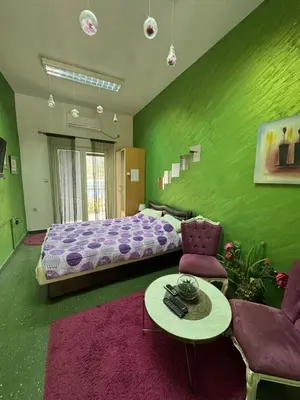 a bedroom with a bed and a table and chairs at Apartment Boka Heart in Plagente