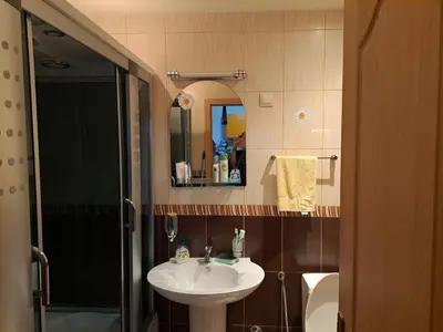 a bathroom with a sink and a shower at Apartman More i Nebo in Petrovac na Moru