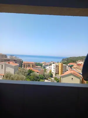 a view of the ocean from a window at Apartman More i Nebo in Petrovac na Moru