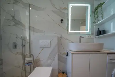 a bathroom with a sink and a mirror at Mia Stella in Kotor