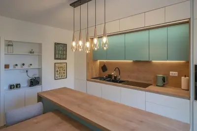 a kitchen with a wooden counter and a sink at Mia Stella in Kotor