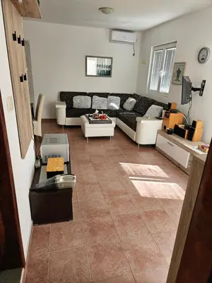 a living room with a couch and a table at Apartman Stepanović in Budva