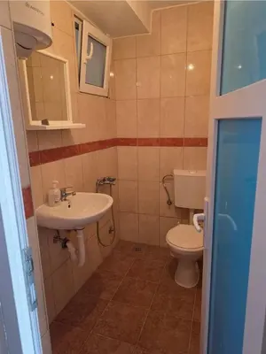 a small bathroom with a toilet and a sink at Ekilo in Dobra Voda
