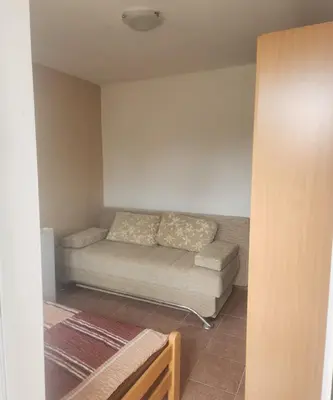 a living room with a couch in a room at Ekilo in Dobra Voda