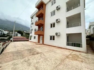 an empty parking lot in front of a building at Студия, 800 м до моря in Bar