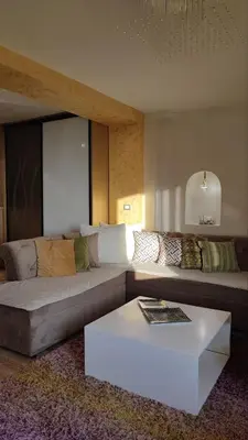 a living room with a couch and a coffee table at Rezevici AZUR in Budva