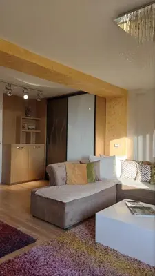 a living room with a couch and a table at Rezevici AZUR in Budva