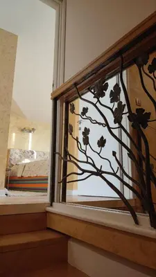a window with a tree mural on the wall at Rezevici AZUR in Budva