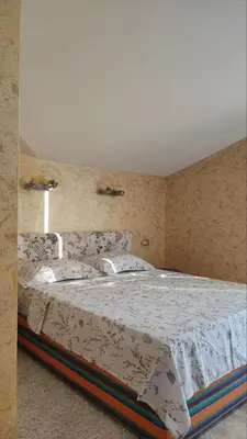 a bedroom with a large bed in a room at Rezevici AZUR in Budva