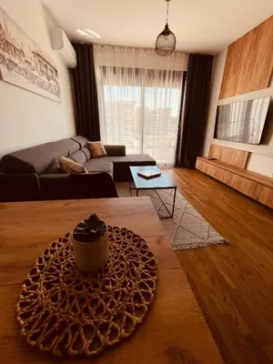 a living room with a couch and a table at Apartments Buongiorno in Ulcinj
