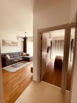 a living room with a couch and a table at Apartments Buongiorno in Ulcinj