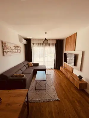a living room with a couch and a tv at Apartments Buongiorno in Ulcinj