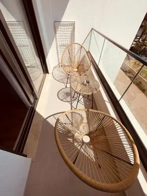 two tables and two chairs on a balcony with glass at Apartments Buongiorno in Ulcinj