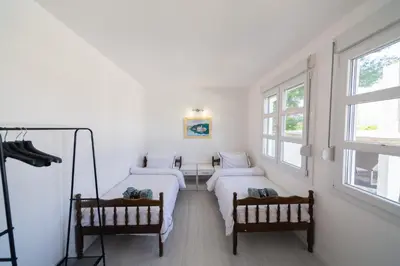 two beds in a room with two windows at Holiday Home Soul
