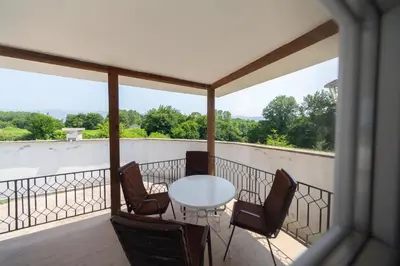 a patio with a table and chairs on a balcony at Holiday Home Soul