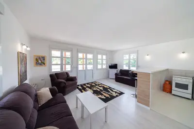 a living room with a couch and a table at Holiday Home Soul