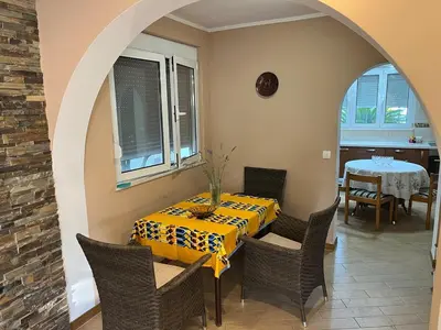 a dining room with a table with a yellow table cloth at Villa Susanj in Bar