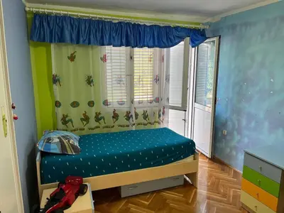a small bedroom with a bed with a window at Villa Susanj in Bar