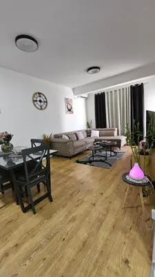 a living room with a couch and a table at Lux Star in Ulcinj