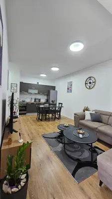 a living room with a couch and a table at Lux Star in Ulcinj