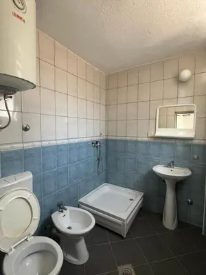 a bathroom with two toilets and a sink at Haus Binas in Ulcinj