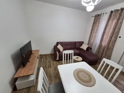 a living room with a couch and a table at Dejana Apartments in Kotor