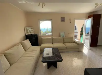 a living room with a couch and a coffee table at Apartments Dana Seaview in Bar