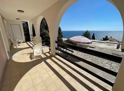 a house with a view of the ocean from a balcony at Apartments Dana Seaview in Bar