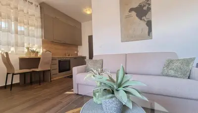a living room with a couch and a table at Boljevic Apartments in Becici