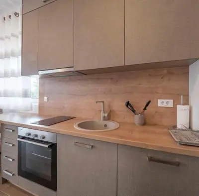 a kitchen with a sink and a counter top at Boljevic Apartments in Becici