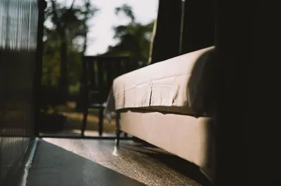 a close up of a bed in a room at Neptun Beach & Forest Cabins in Ulcinj