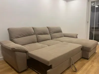 a couch sitting in a living room next to at Apartmants Taco Ulcinj in Ulcinj