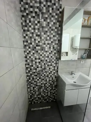 a bathroom with a shower and a sink at Apartmants Taco Ulcinj in Ulcinj