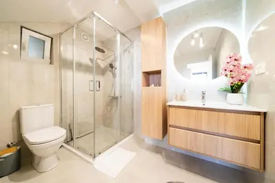 a bathroom with a shower and a toilet and a sink at Latković Charming Studio in Ulcinj